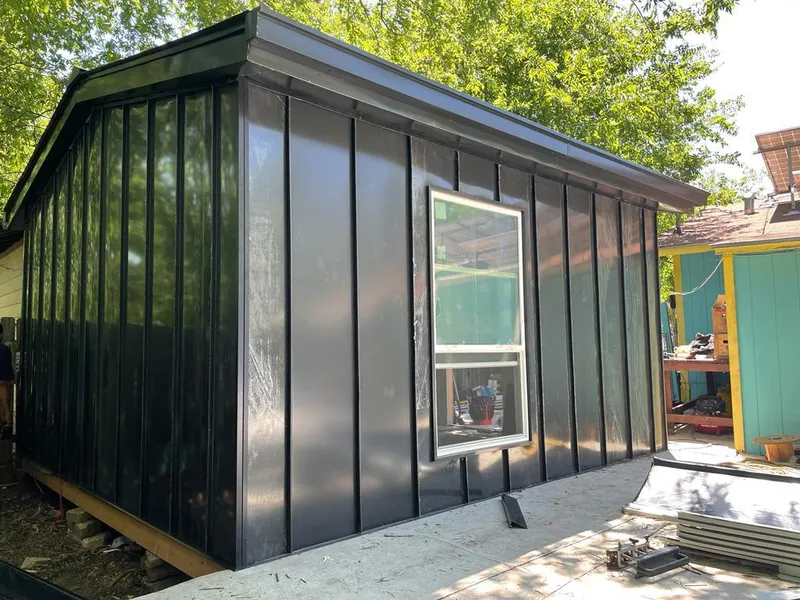 Black standing seam metal wall panels for Roof Inspection in Picayune